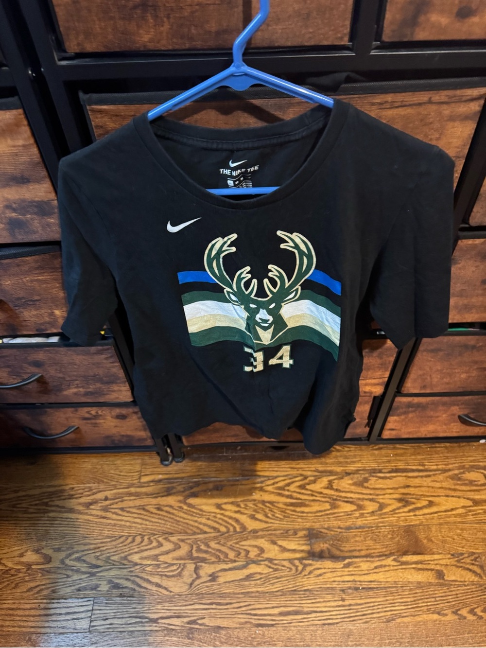 Nike Kids Black Milwaukee Bucks Deer Graphic Tee with Blue and Green Stripes